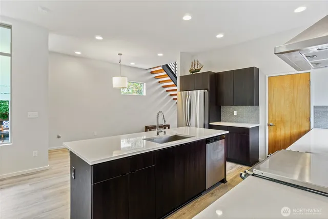 a bathroom with a sink a mirror and a shower
