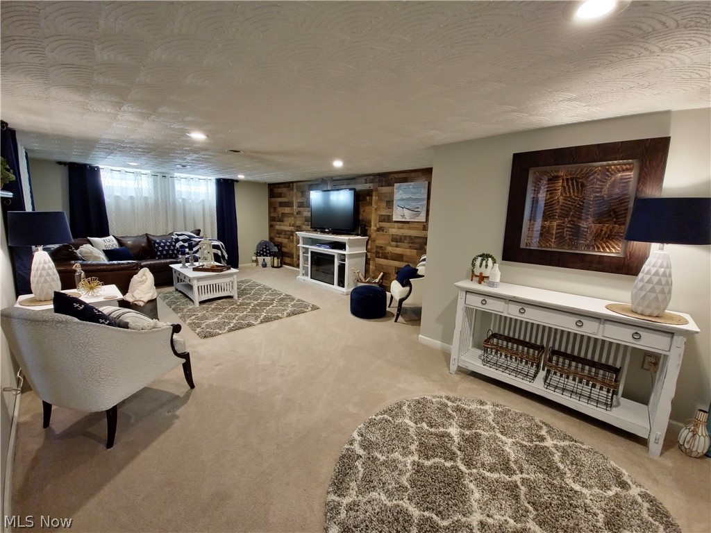 1681 Rush Road Wickliffe, OH 44092 - Photo 24 of 33 Finished Basement with light carpet, a textured ceiling, and a fireplace