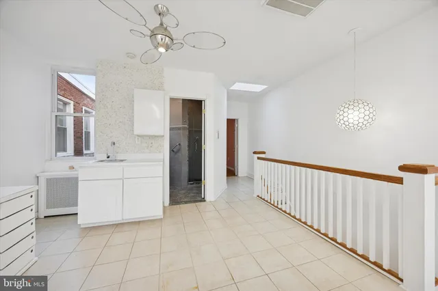 a bathroom with a sink a mirror and a shower