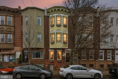 a view of a car parked in front of a building