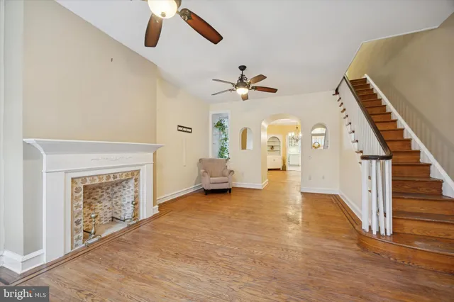 a view of an empty room and a fireplace