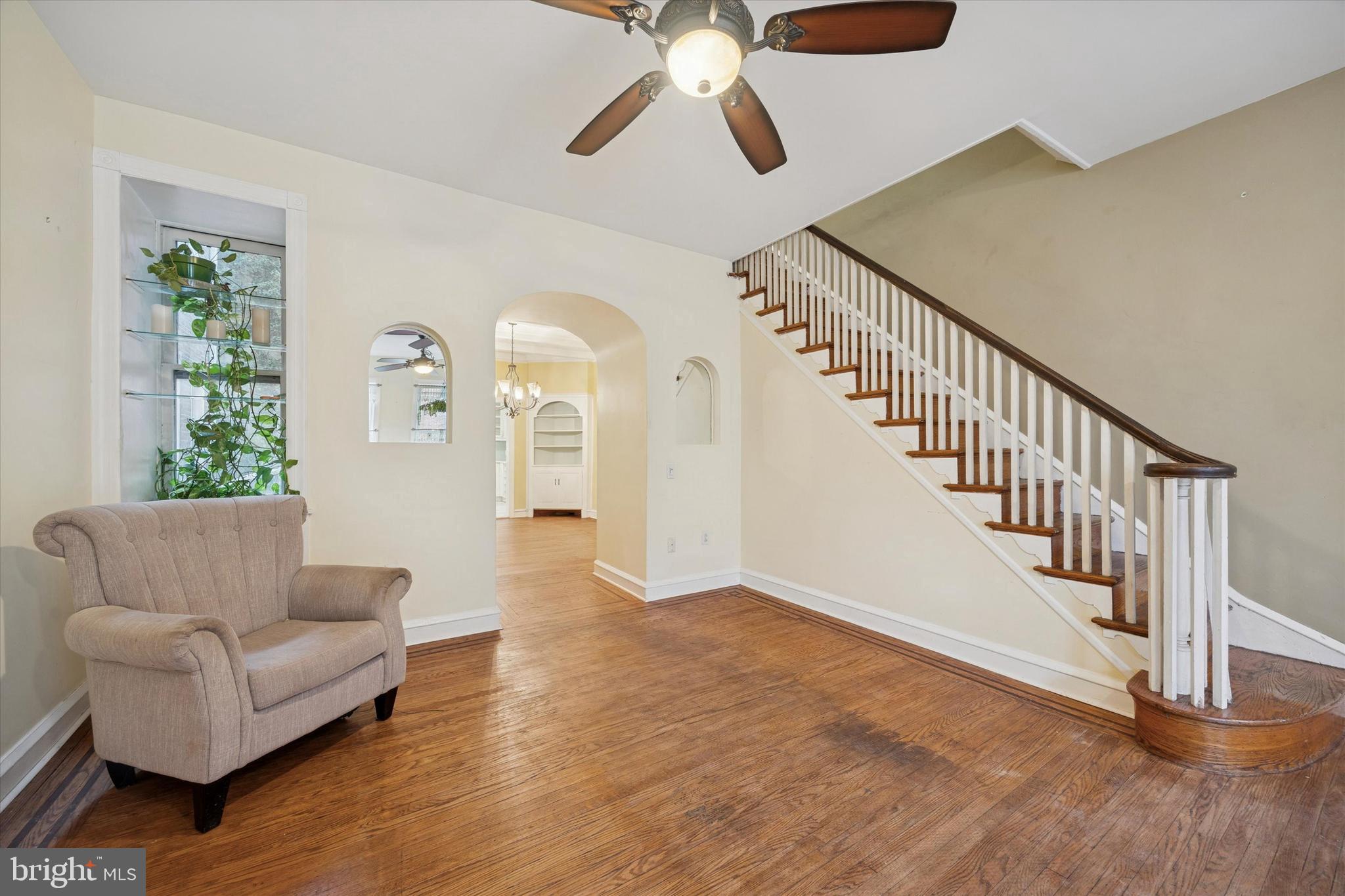 1605 South 8th Street Philadelphia, PA 19148 - Photo 5 of 26 a living room with furniture and entryway with wooden floor