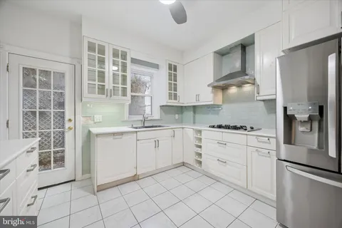 a kitchen with appliances cabinets and a sink