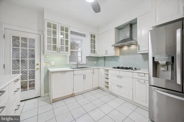 a kitchen with appliances cabinets and a sink