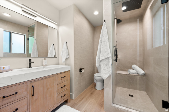 2163 Borg Drive Sandy, UT 84092 - Photo 16 of 31 Full bathroom with vanity, a shower stall, light wood-style floors, and recessed lighting