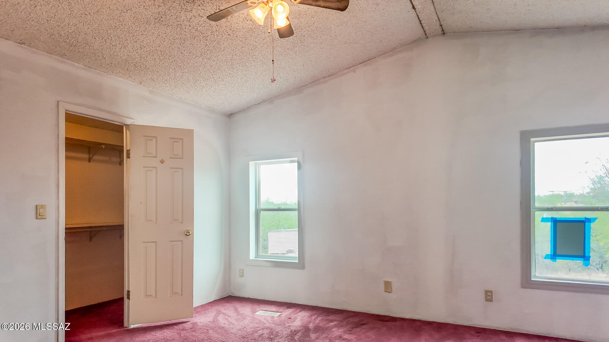 27651 South Canoa Road Amado, AZ 85645 - Photo 6 of 20 an empty room with windows and closet