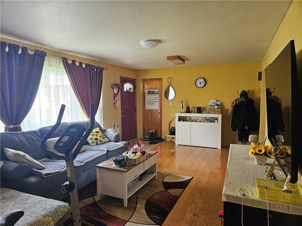 521 West Butler Street Mercer, PA 16137 - Photo 3 of 23 a living room with furniture a flat screen tv and a window