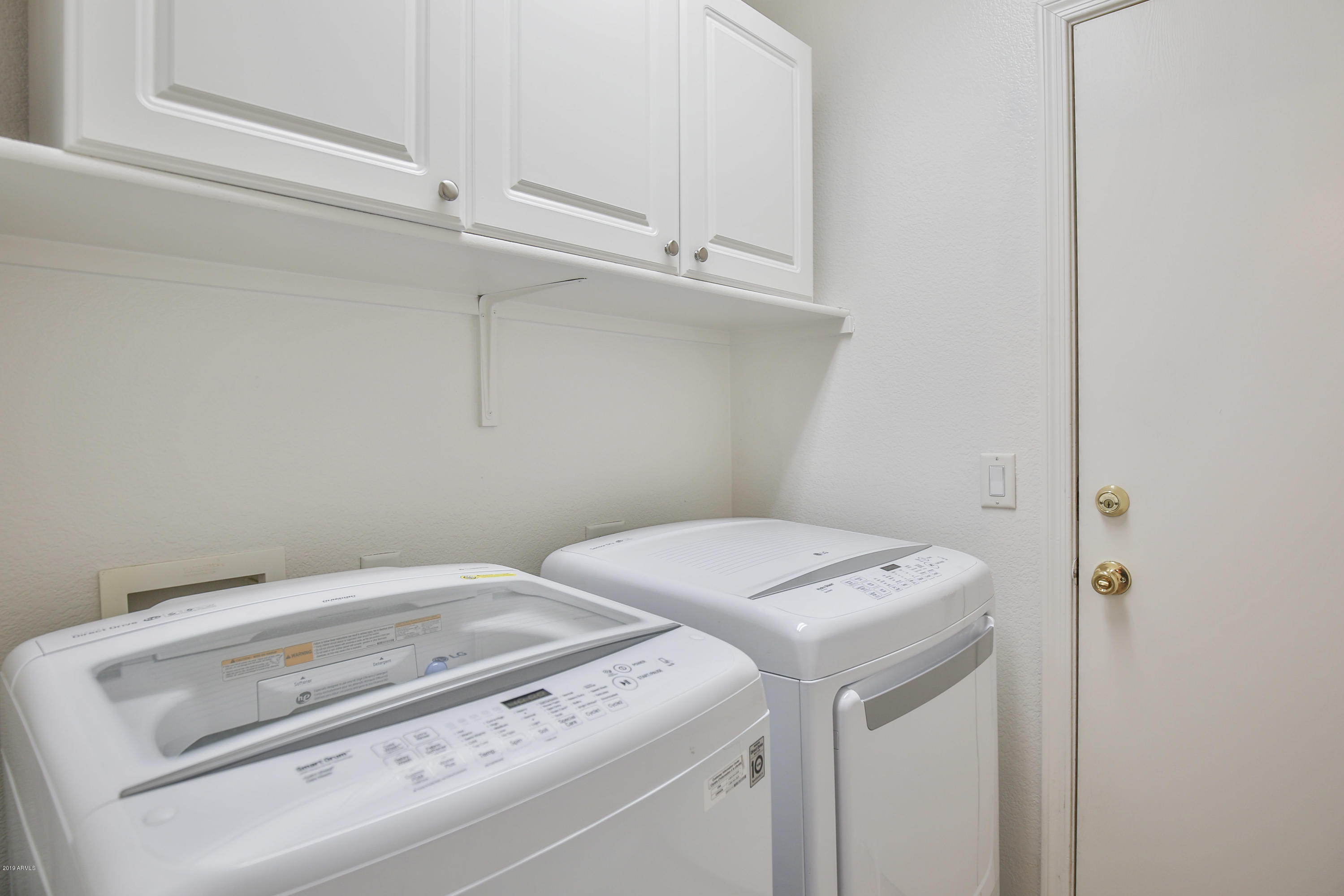 4328 South Rim Court Gilbert, AZ 85297 - Photo 26 of 36 a utility room with dryer and washer