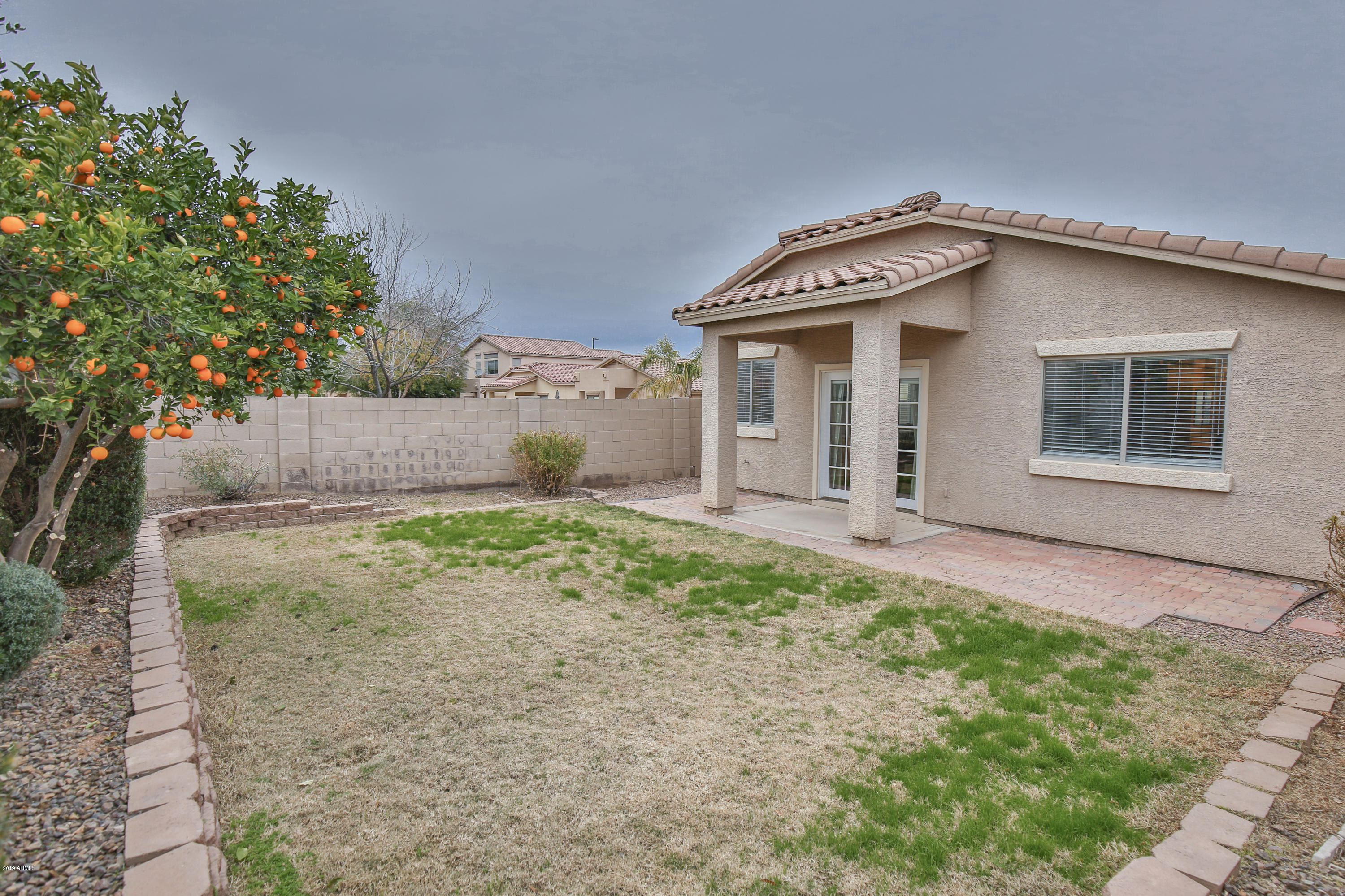 4328 South Rim Court Gilbert, AZ 85297 - Photo 29 of 36 a front view of a house with garden