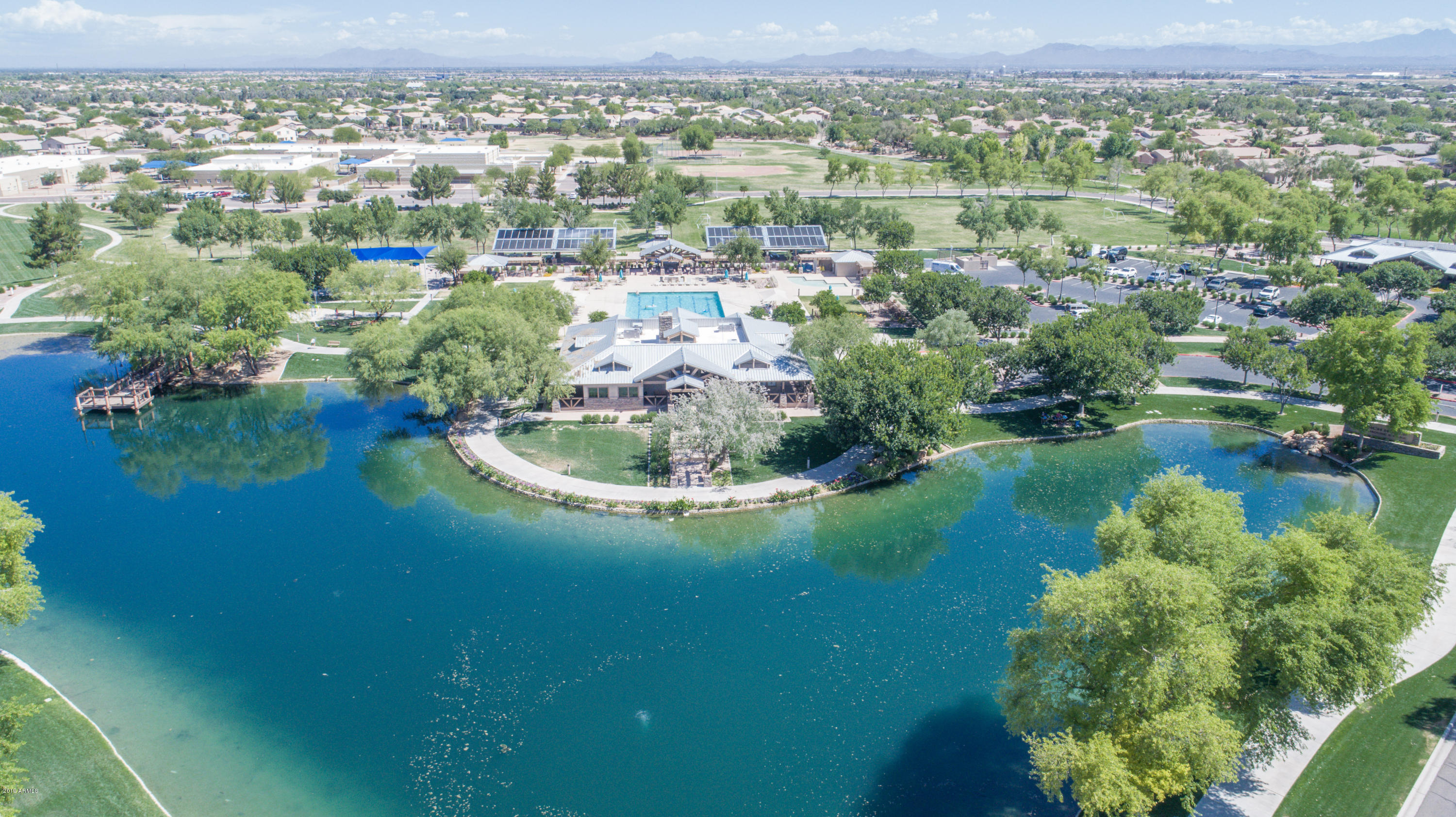 4328 South Rim Court Gilbert, AZ 85297 - Photo 5 of 36 a view of a lake with a city