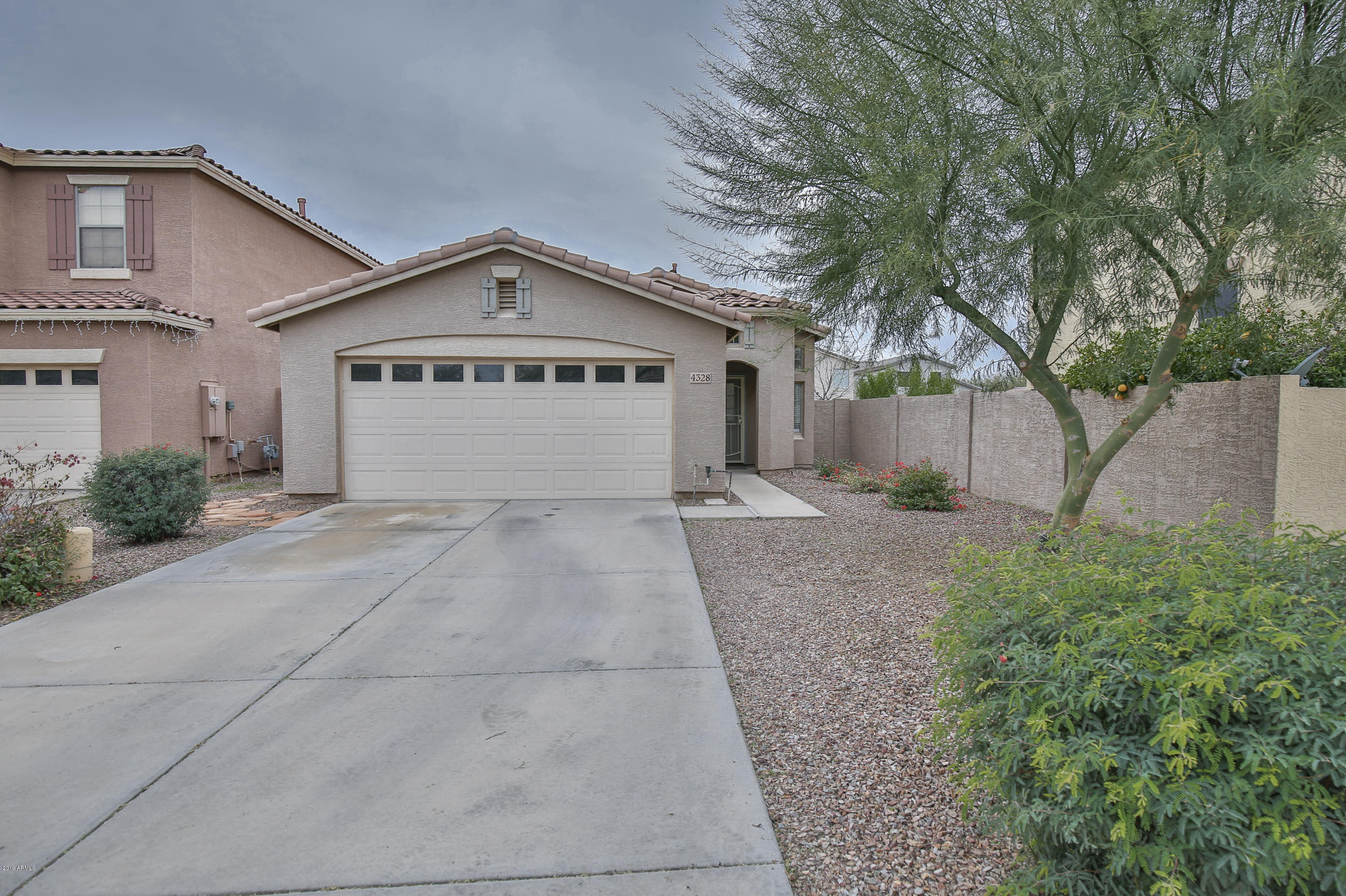 4328 South Rim Court Gilbert, AZ 85297 - Photo 7 of 36 a view of garage and yard