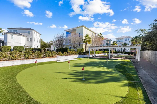 a swimming pool with outdoor seating and yard