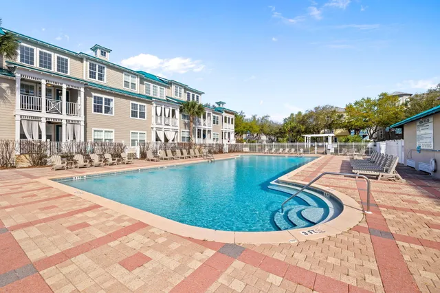 a view of a swimming pool with a lounge chair
