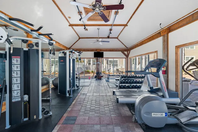 a gym room with lots of gym equipment