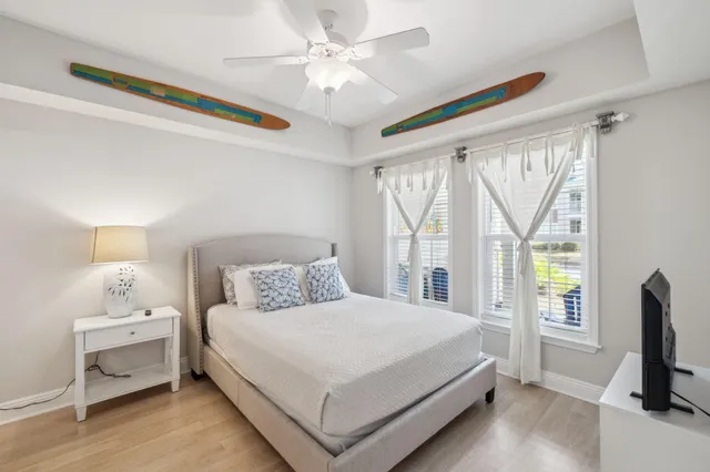 a bedroom with a bed and a window with the outer view