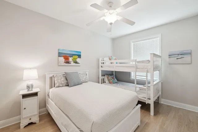 a bed room with a bed and a chandelier