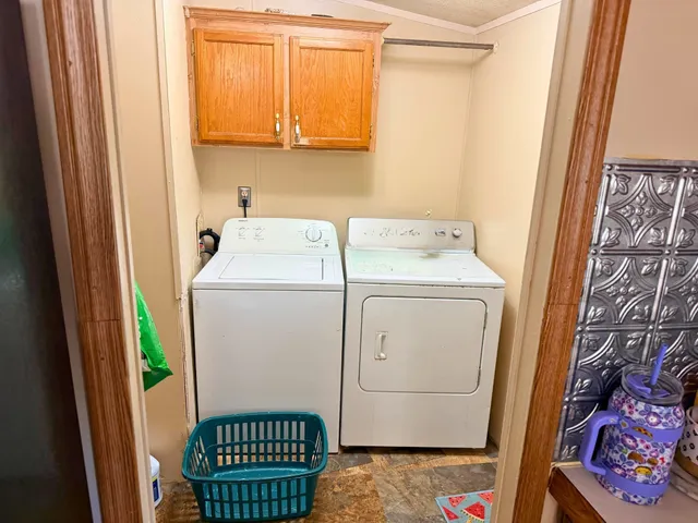 a view of a dining room with furniture and a chandelier