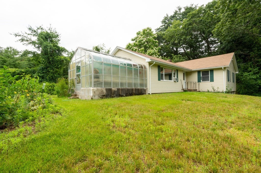 2 Leslie Road Ipswich, MA 01938 - Photo 2 of 26 a front view of house with yard and green space