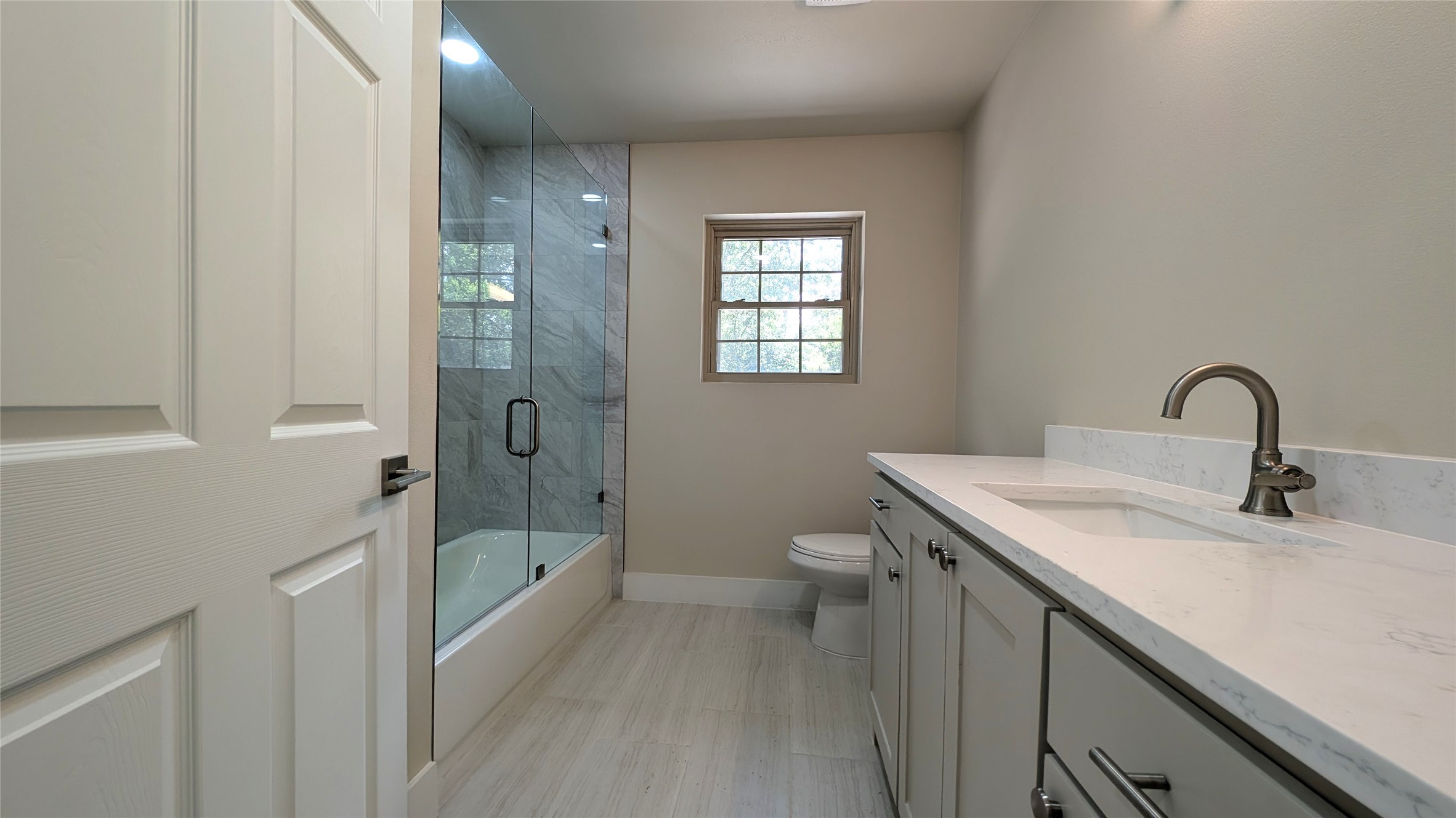 11811 Sleepy Hollow Road Manchaca, TX 78652 - Photo 12 of 31 a bathroom with a sink toilet and shower