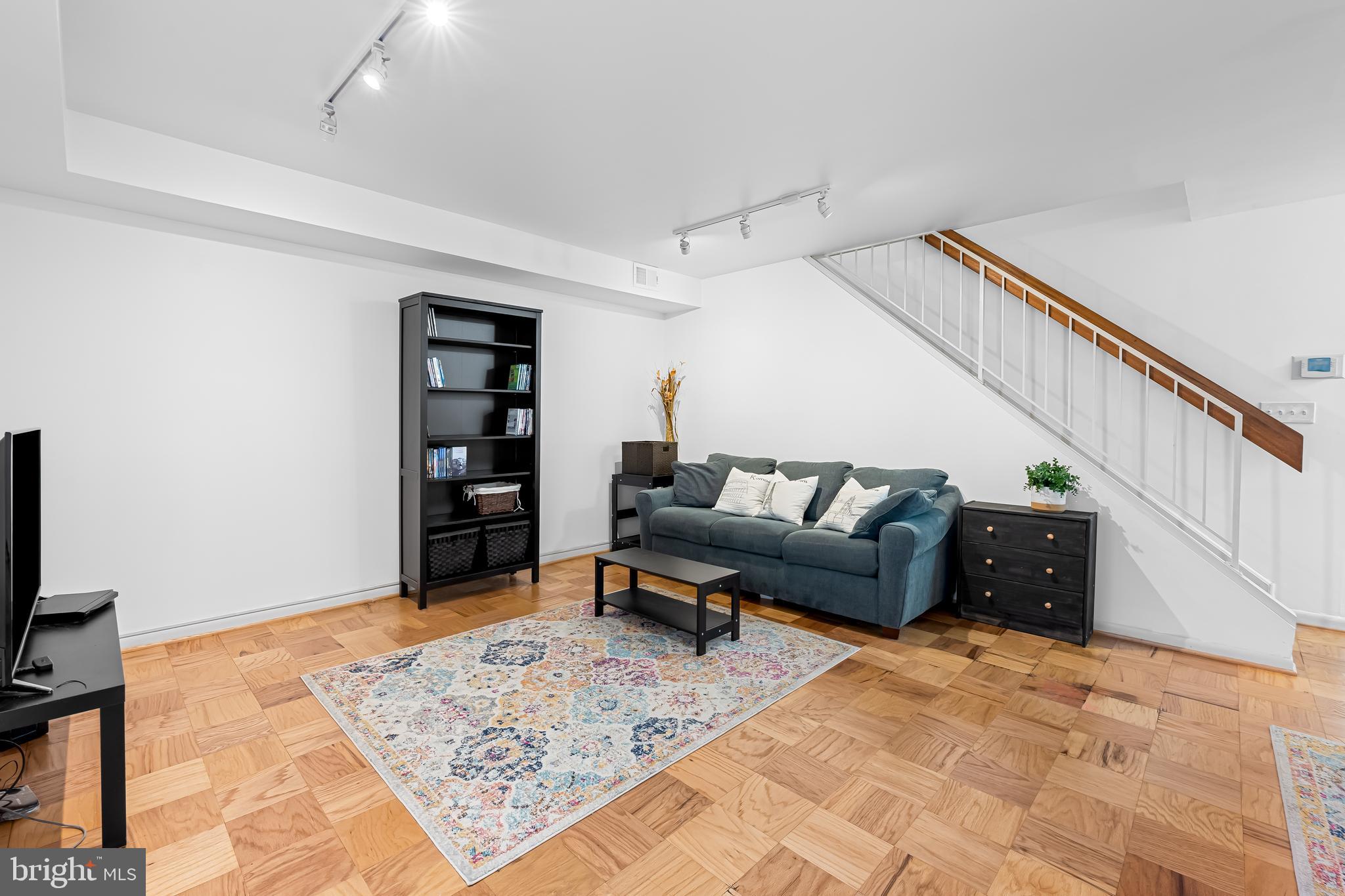 17 Hamill Road, Unit F Baltimore, MD 21210 - Photo 3 of 47 a living room with furniture and a rug