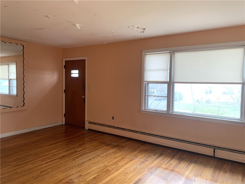 316 Mail Coach Road Portsmouth, RI 02871 - Photo 4 of 30 Living room with hardwood floors looking out the front of the house