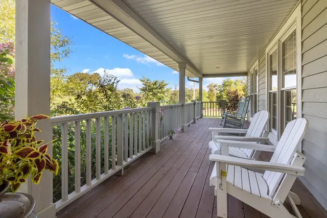 a view of a porch with wooden floor and outdoor space