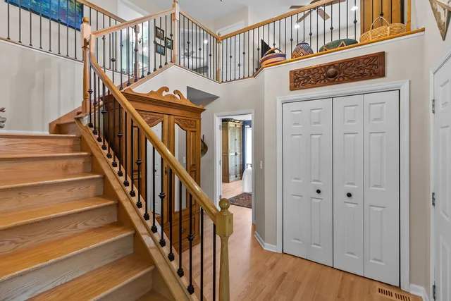 a living room with furniture a rug and a large window