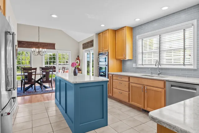 a bed room with a bed and a chandelier