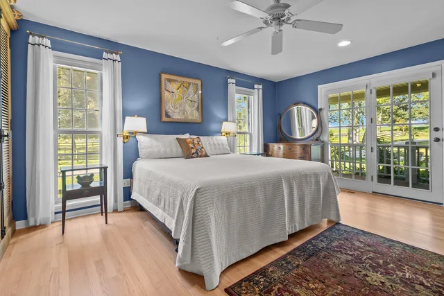 a bedroom with a large bed and a window