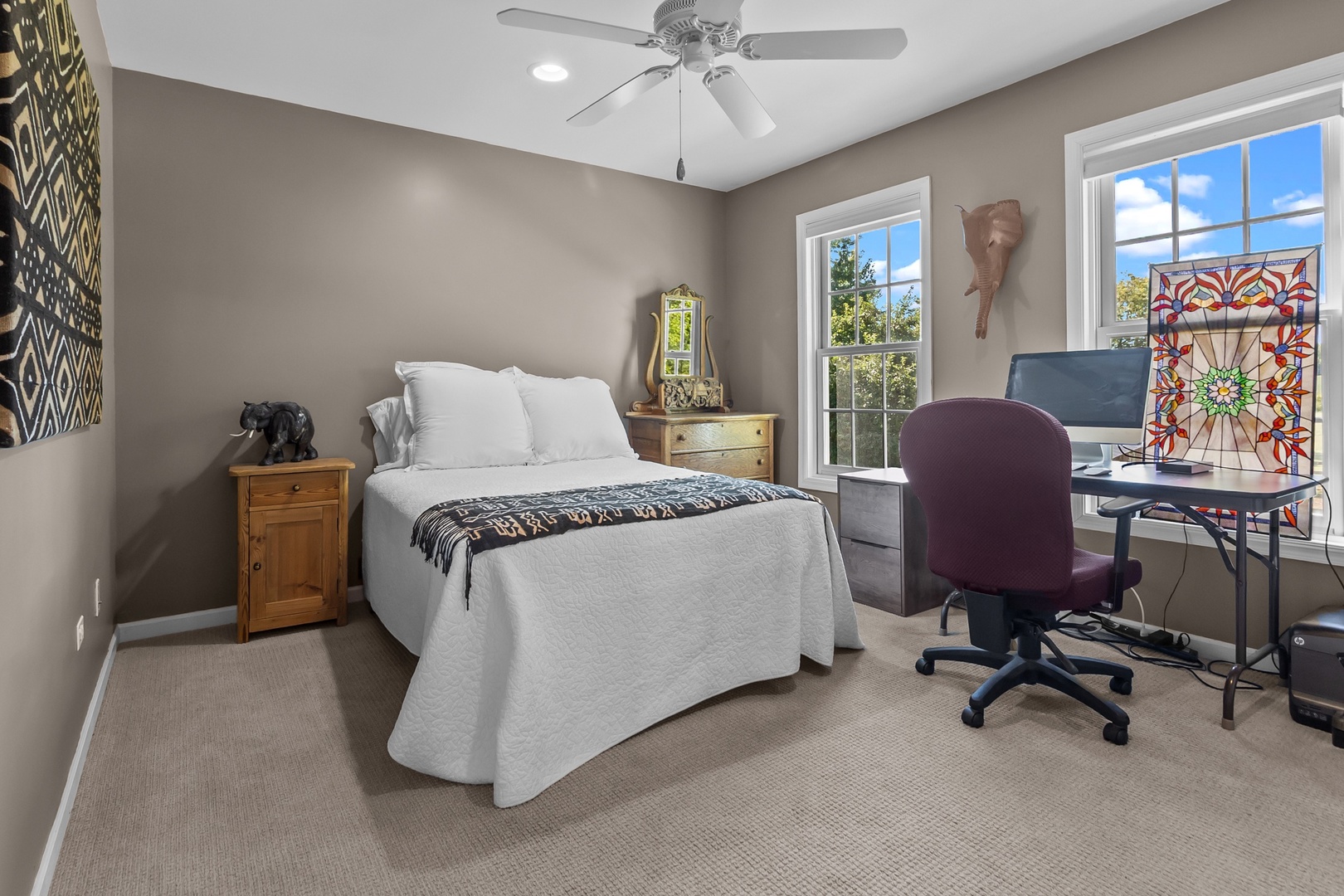 19303 McGuire Road Harvard, IL 60033 - Photo 29 of 36 a bedroom with a bed and a chandelier