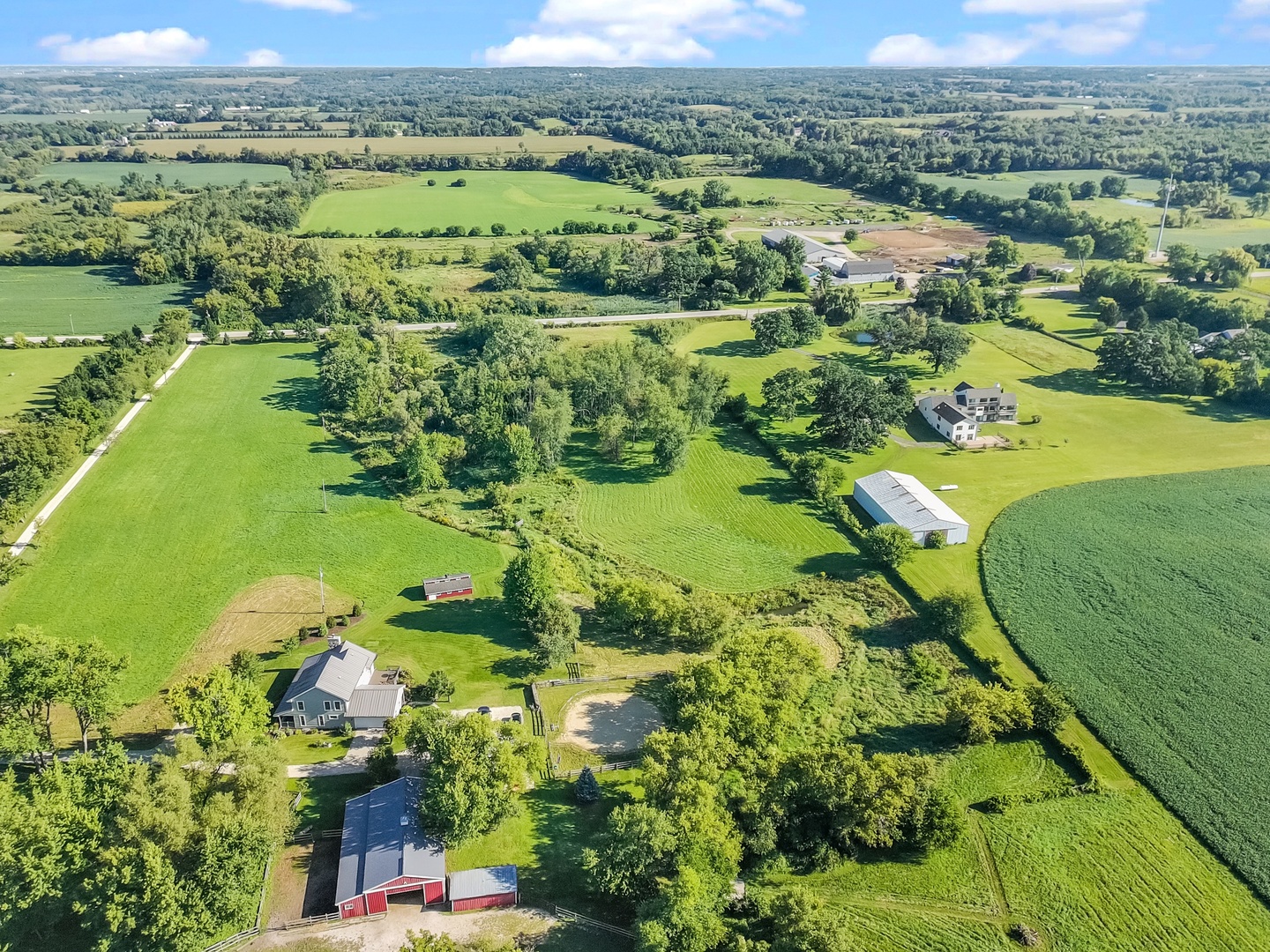 19303 McGuire Road Harvard, IL 60033 - Photo 7 of 36 a view of a lake with a houses