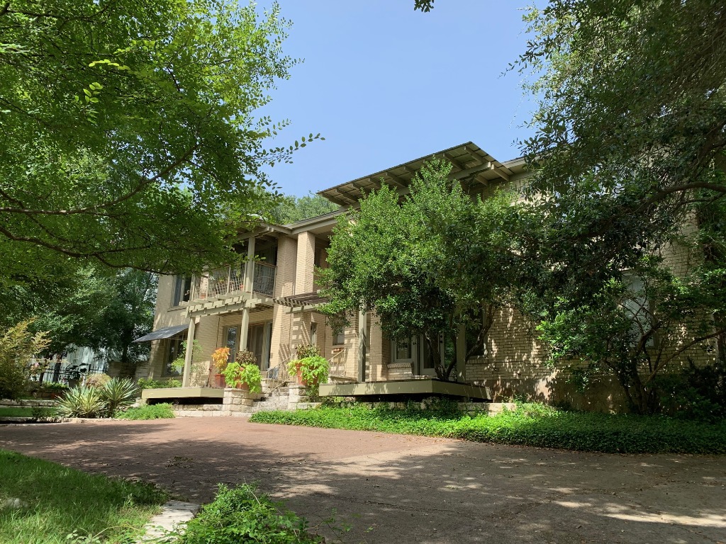 1605 Pease Road, Unit 2 Austin, TX 78703 - Photo 1 of 1 a front view of a house with a yard and garage
