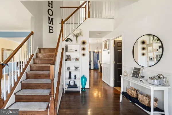 a view of an entryway with wooden floor