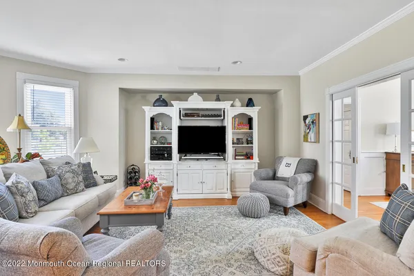 a living room with furniture fireplace and a flat screen tv