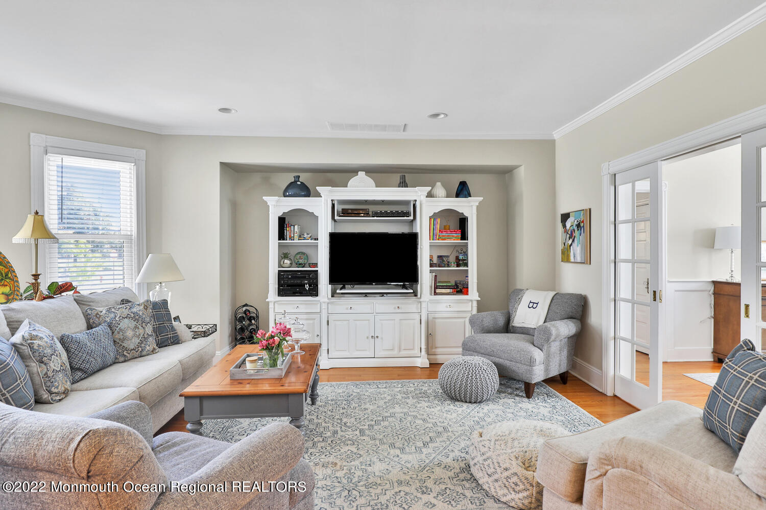 502 Tuttle Avenue Spring Lake, NJ 07762 - Photo 15 of 36 a living room with furniture fireplace and a flat screen tv
