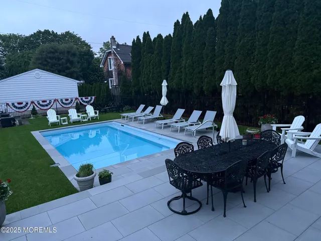 a view of yard with furniture and garden