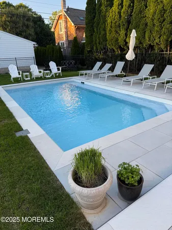 a view of a fountain with potted plants