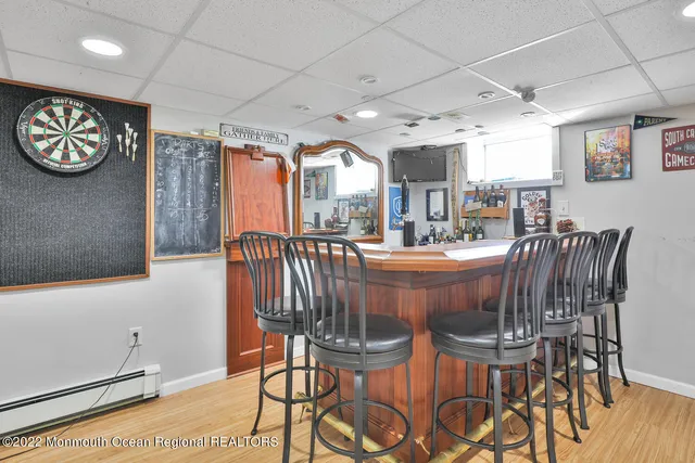 a dining area with furniture and a large window