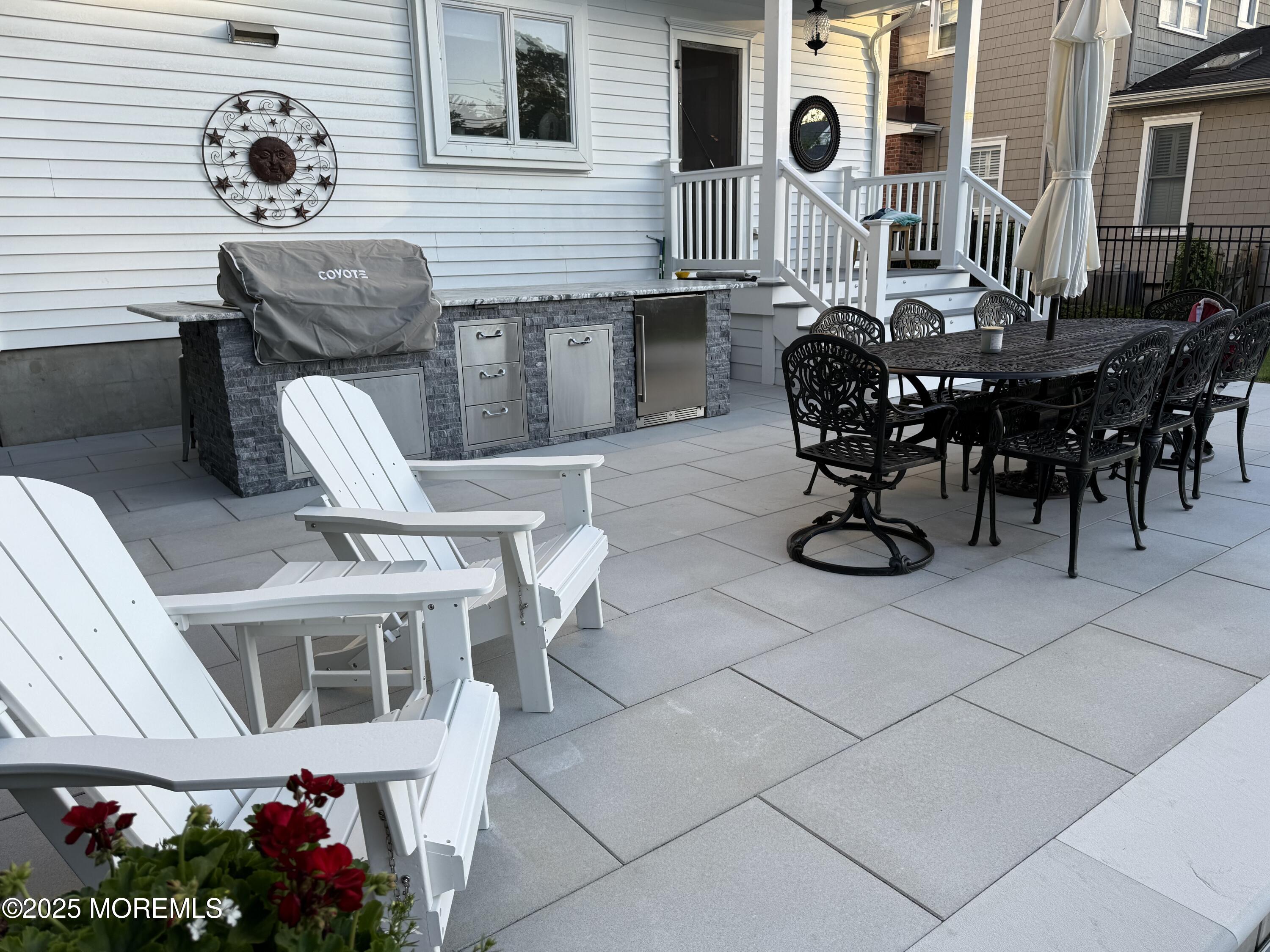 502 Tuttle Avenue Spring Lake, NJ 07762 - Photo 5 of 36 a view of a chairs and table in a patio