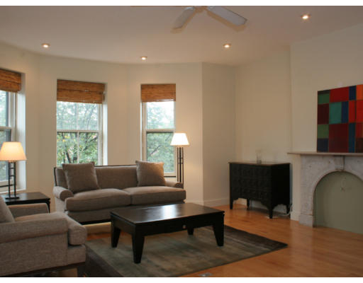114 West Concord Street, Unit 2 Boston, MA 02118 - Photo 2 of 9 a living room with furniture and a fireplace