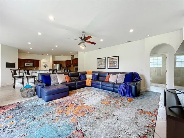 a view of a kitchen with furniture and an empty room
