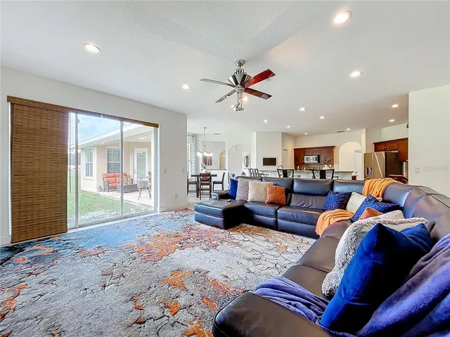 a living room with furniture and a rug