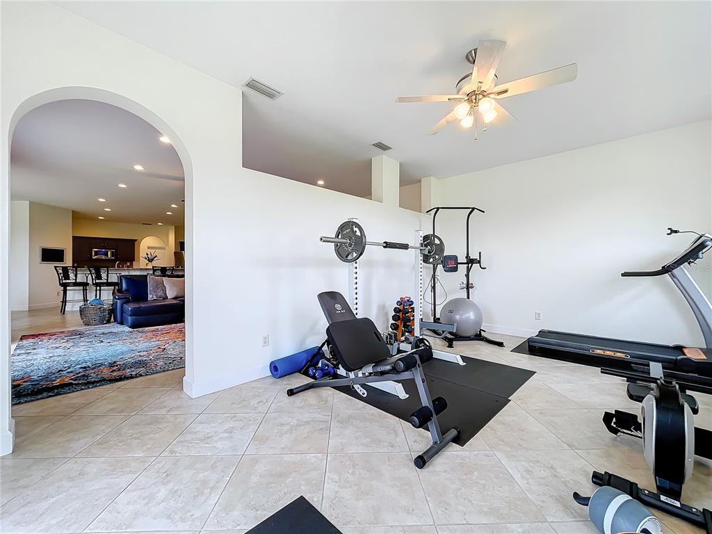 275 Cr 552 Bushnell Bushnell, FL 33513 - Photo 26 of 69 a room with gym equipment and view of living room