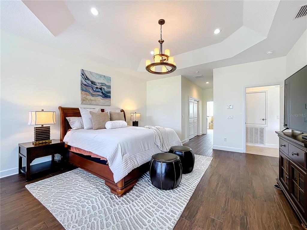 275 Cr 552 Bushnell Bushnell, FL 33513 - Photo 30 of 69 a bedroom with a bed and wooden floor