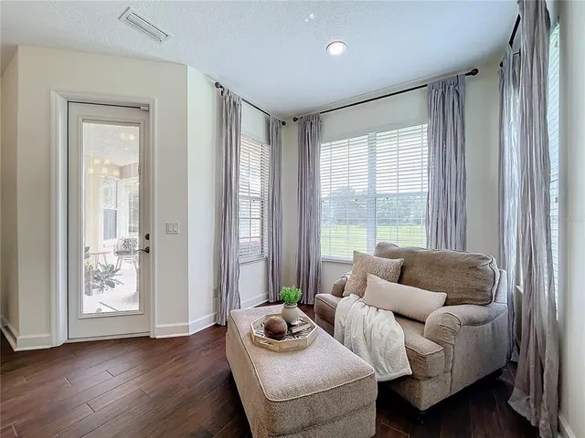 a white toilet sitting next to a window