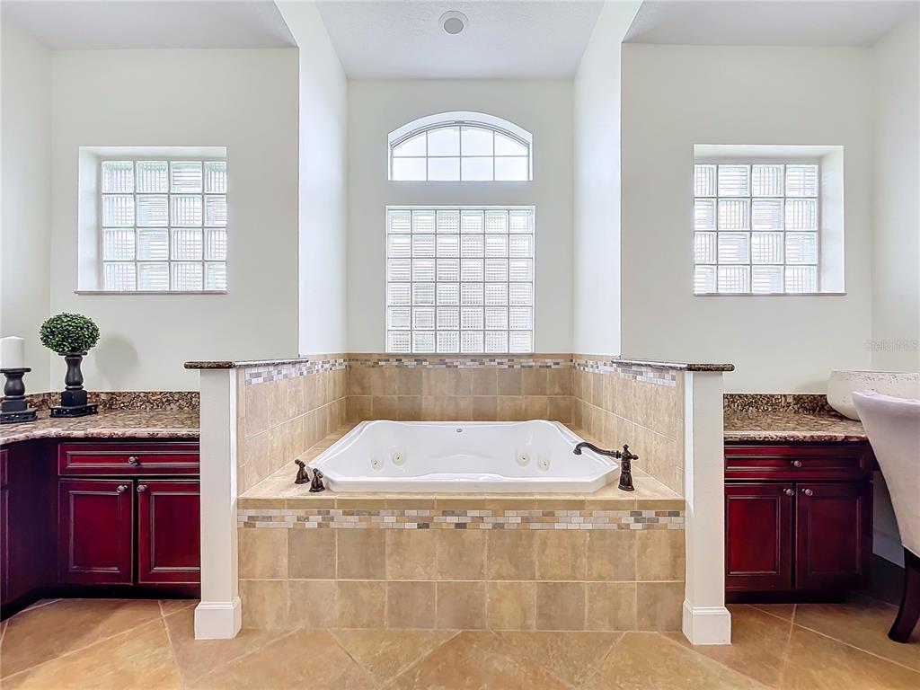 275 Cr 552 Bushnell Bushnell, FL 33513 - Photo 36 of 69 a bathroom with a bathtub and a sink