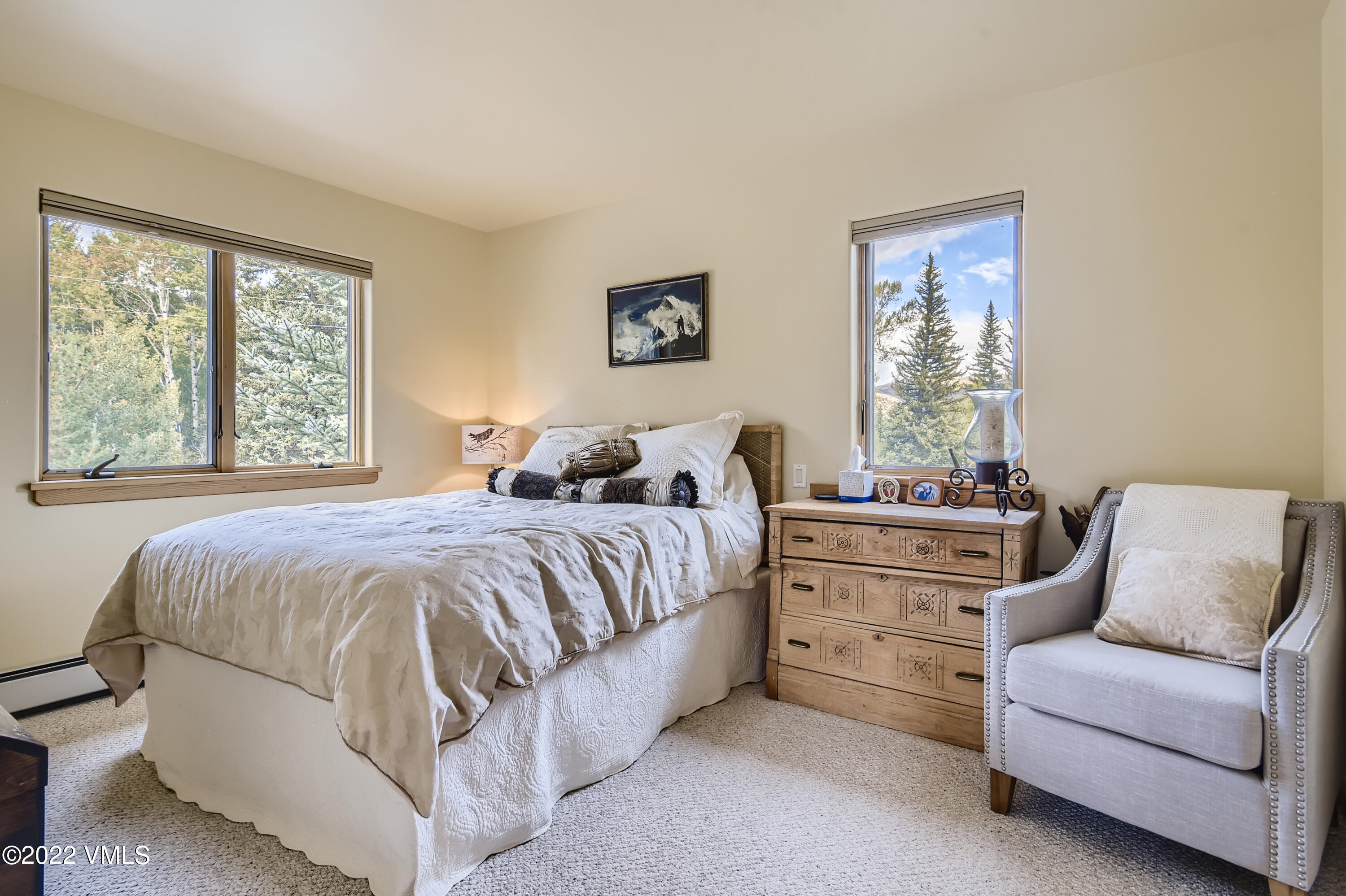 1476 Lake Creek Road Edwards, CO 81632 - Photo 14 of 35 a spacious bedroom with a bed and a couch
