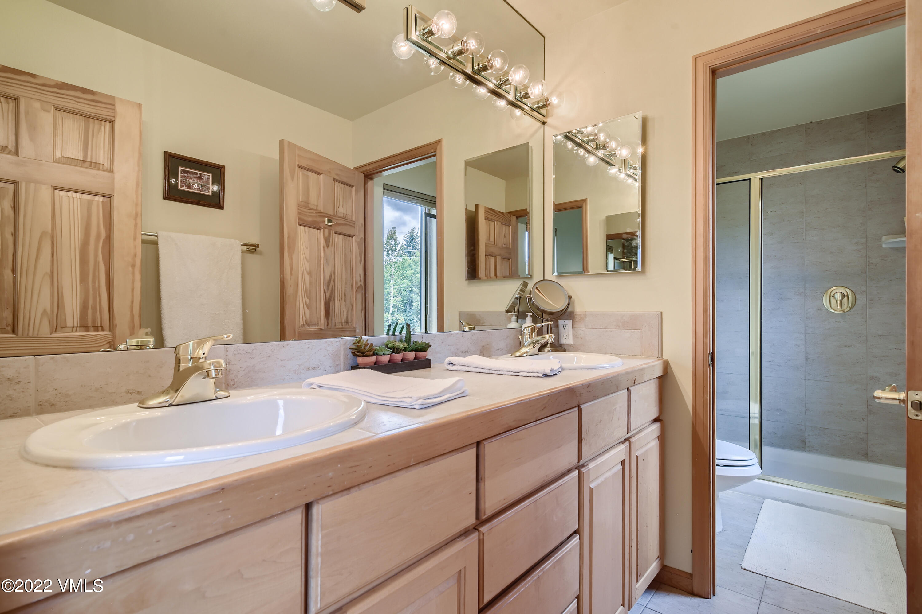 1476 Lake Creek Road Edwards, CO 81632 - Photo 17 of 35 a bathroom with a sink double vanity granite tub and shower