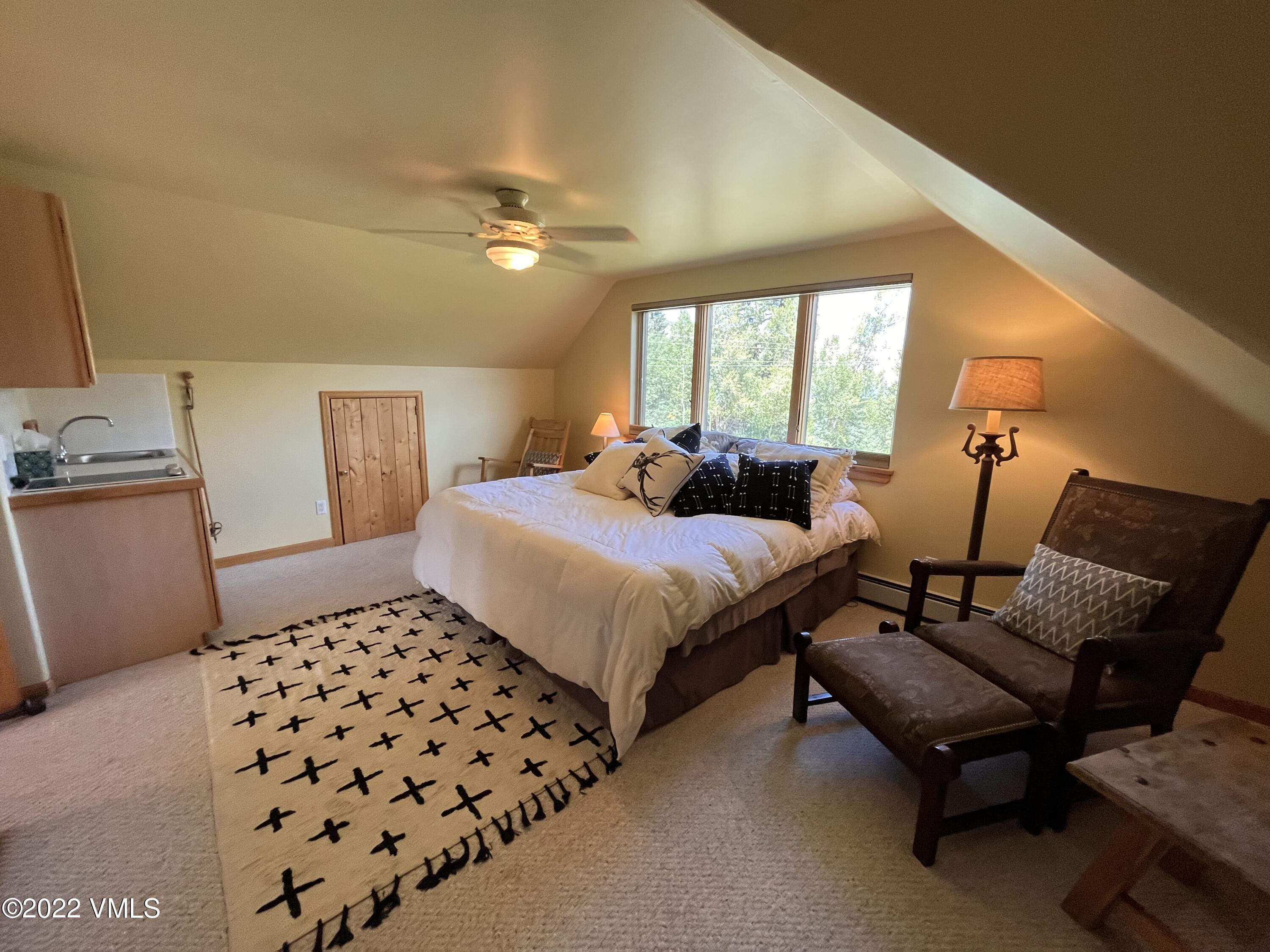 1476 Lake Creek Road Edwards, CO 81632 - Photo 20 of 35 a bedroom with a bed and window