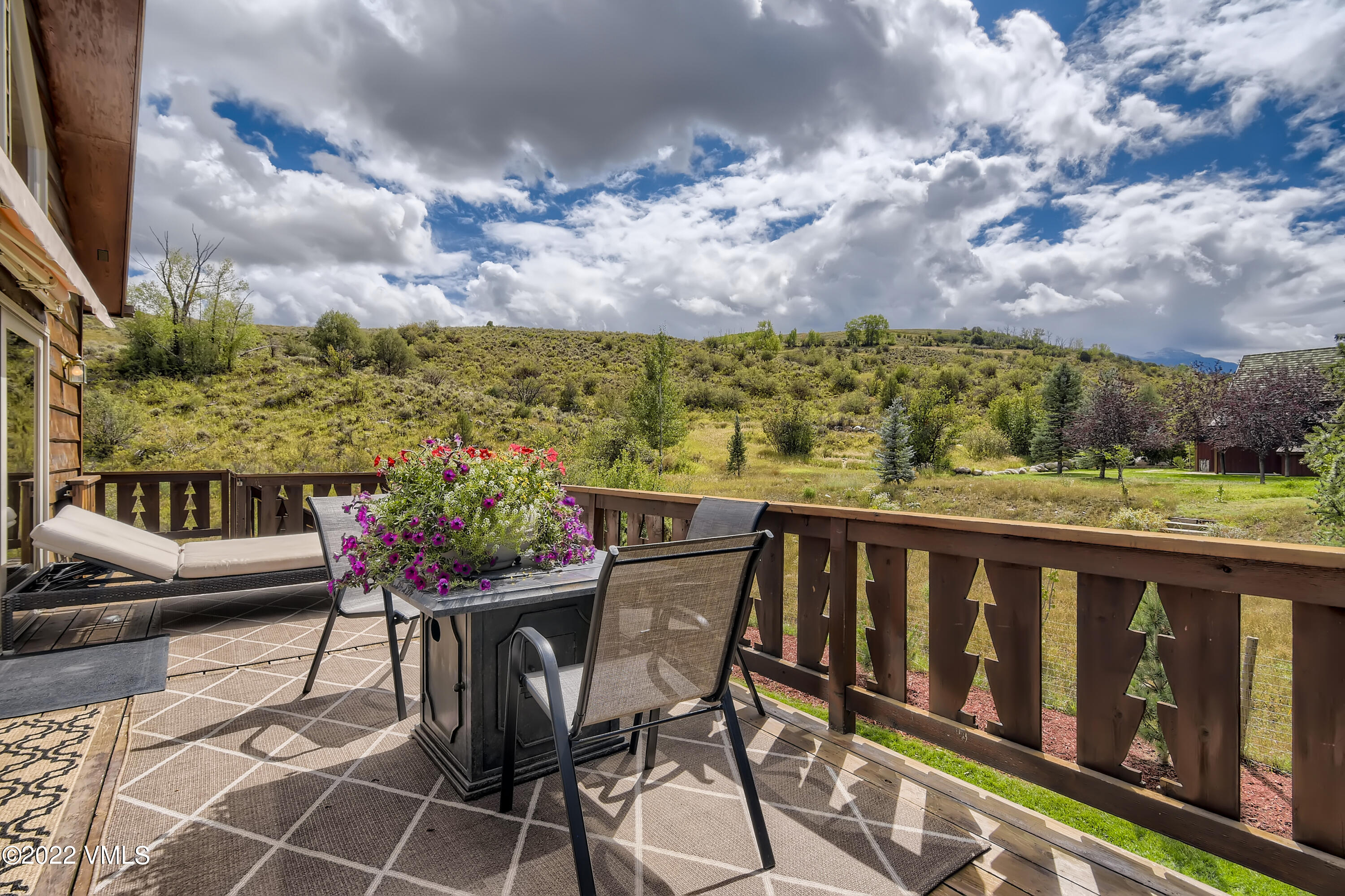 1476 Lake Creek Road Edwards, CO 81632 - Photo 3 of 35 a view of a chairs and table in the balcony